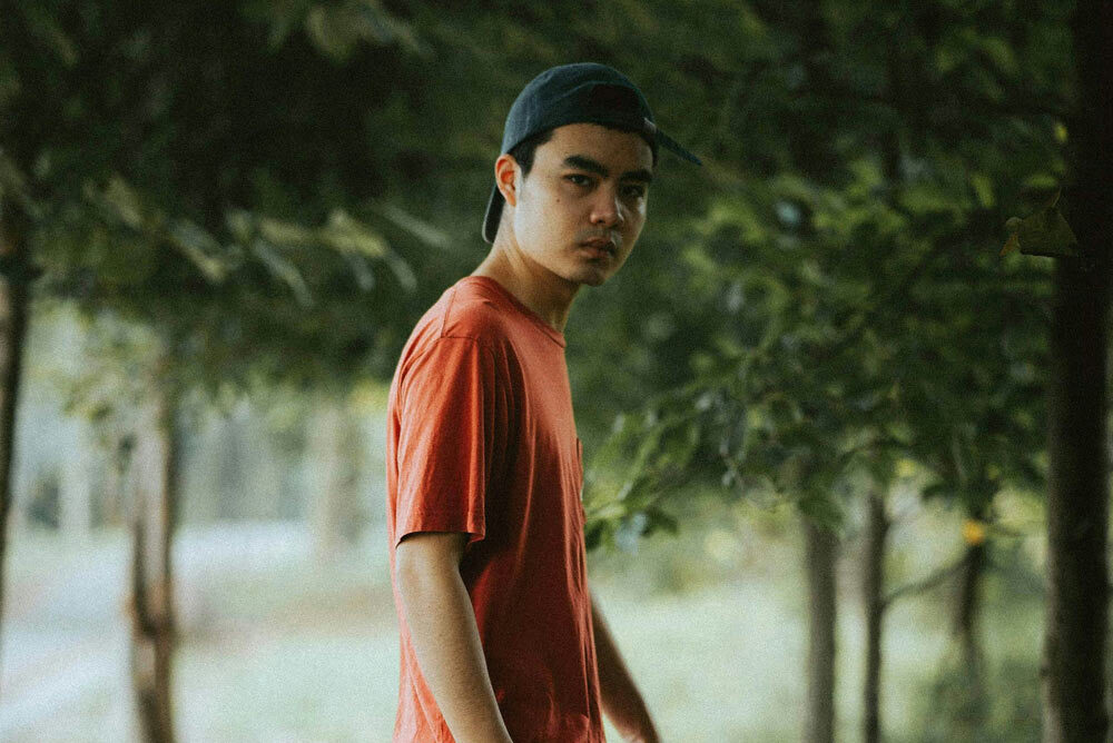 boy in backwards hat in nature