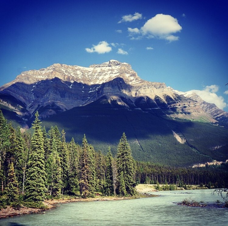 mountain sitting atop lake